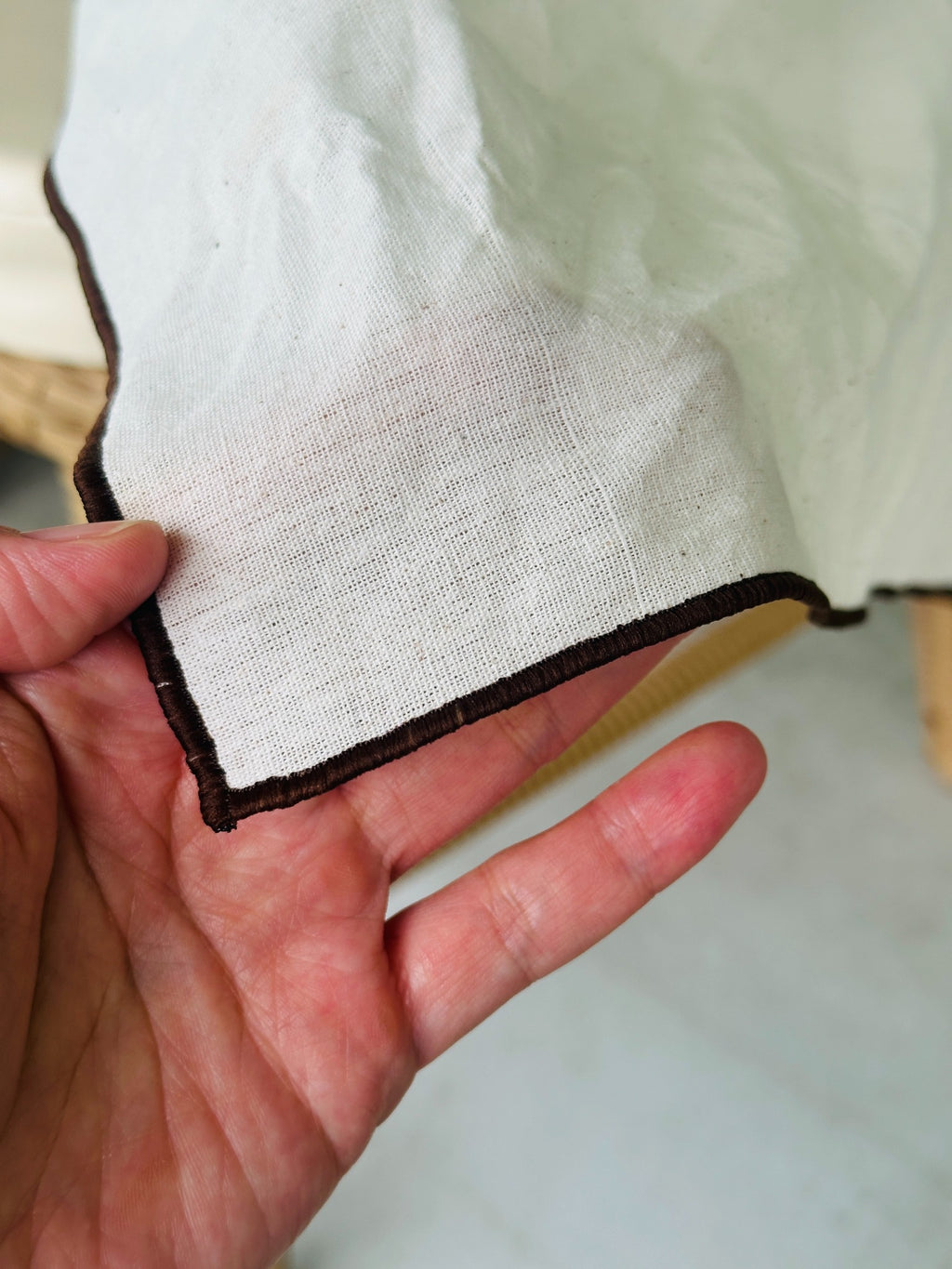 Close-up of premium bojagi fabric and brown stitched edge